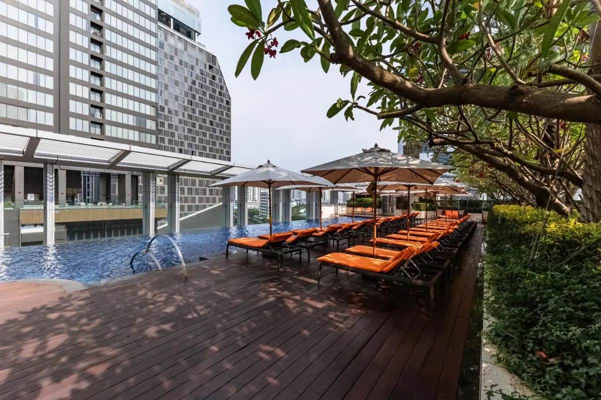 Bangkok Marriott Hotel Sukhumvit Rooftop Pool Area with Lounge Chairs and Urban Views in Wattana Bangkok