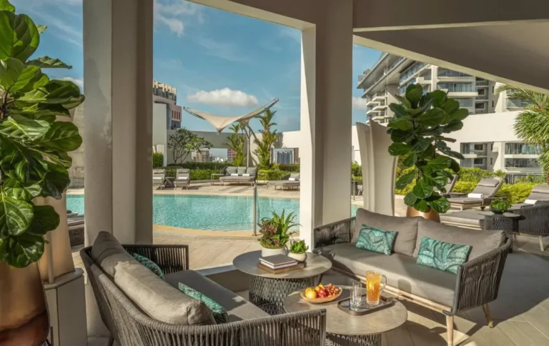 Rooftop Pool Area with Lounge Seating and Shade Structure in Orchard Singapore