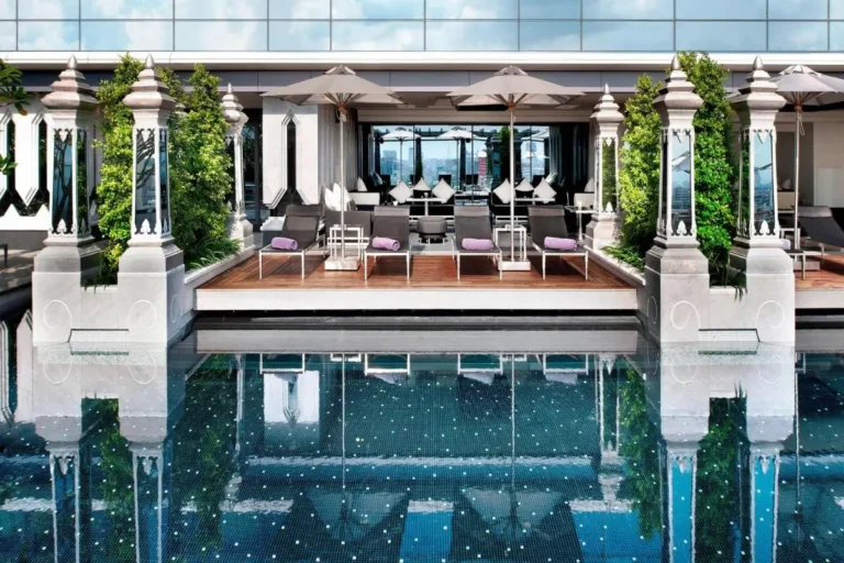 Rooftop Swimming Pool and Lounge Area with Urban Views in Pathumwan Bangkok