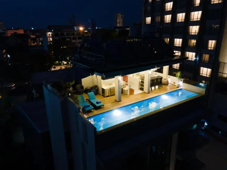 Rooftop Swimming Pool and Relaxation Area with Jacuzzi and Seating in Chang Khlan Chiang Mai