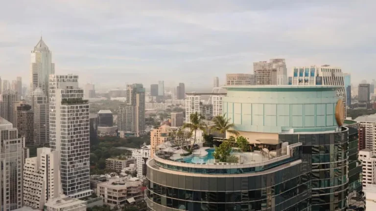 Rooftop Swimming Pool and Wellness Area with Cityscape Views in Pathumwan Bangkok