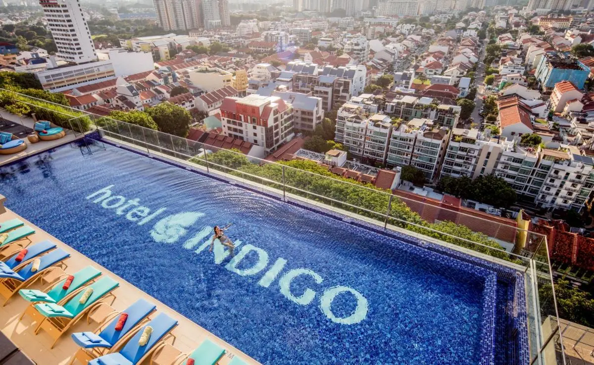 Rooftop Swimming Pool with City Views and Lounge Seating in Singapore
