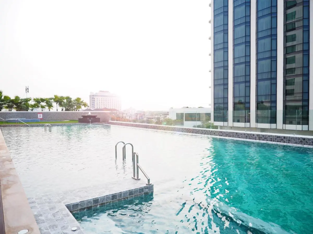 The Empress Premier Chiang Mai Rooftop Swimming Pool with City Views and Palm Trees in Chang Khlan Chiang Mai Thailand