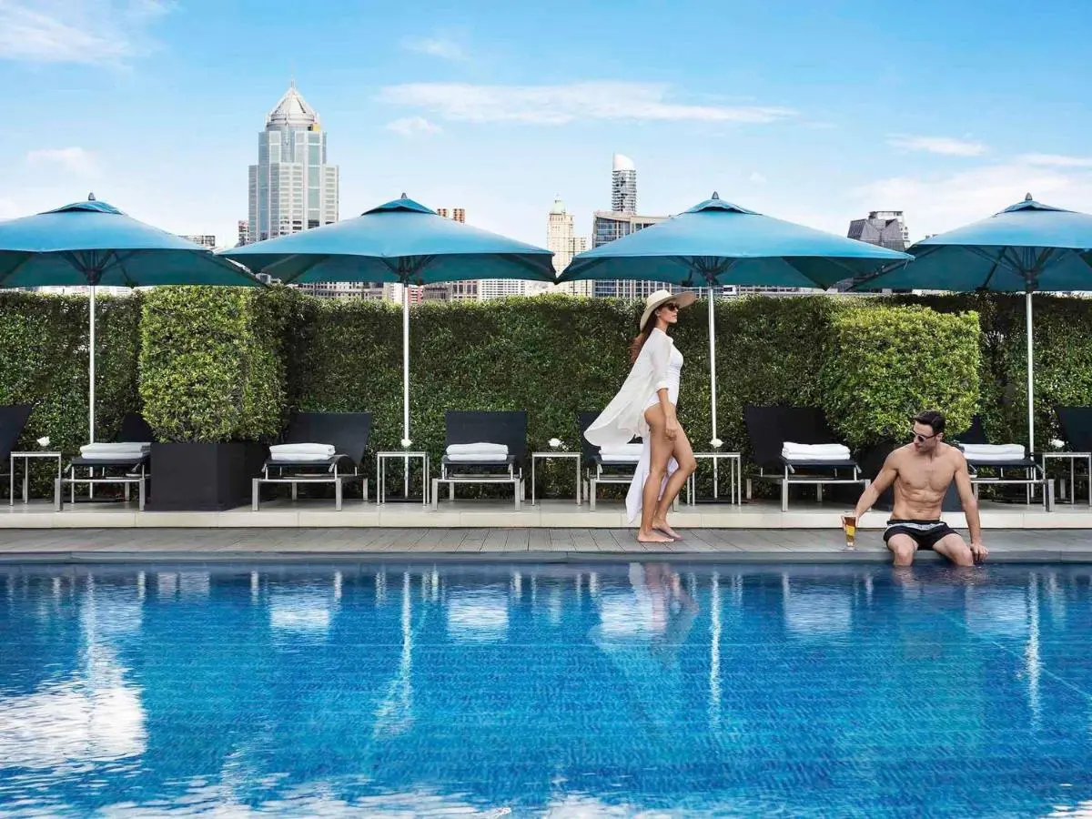 Sofitel Bangkok Sukhumvit Rooftop Swimming Pool with Lounge Chairs and City Skyline View in Wattana Bangkok