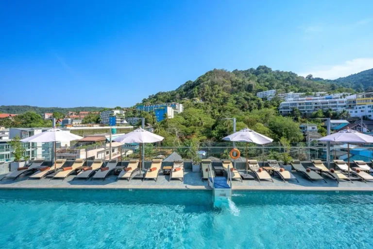Rooftop Swimming Pool with Lounge Chairs and Scenic Views at Patong Beach