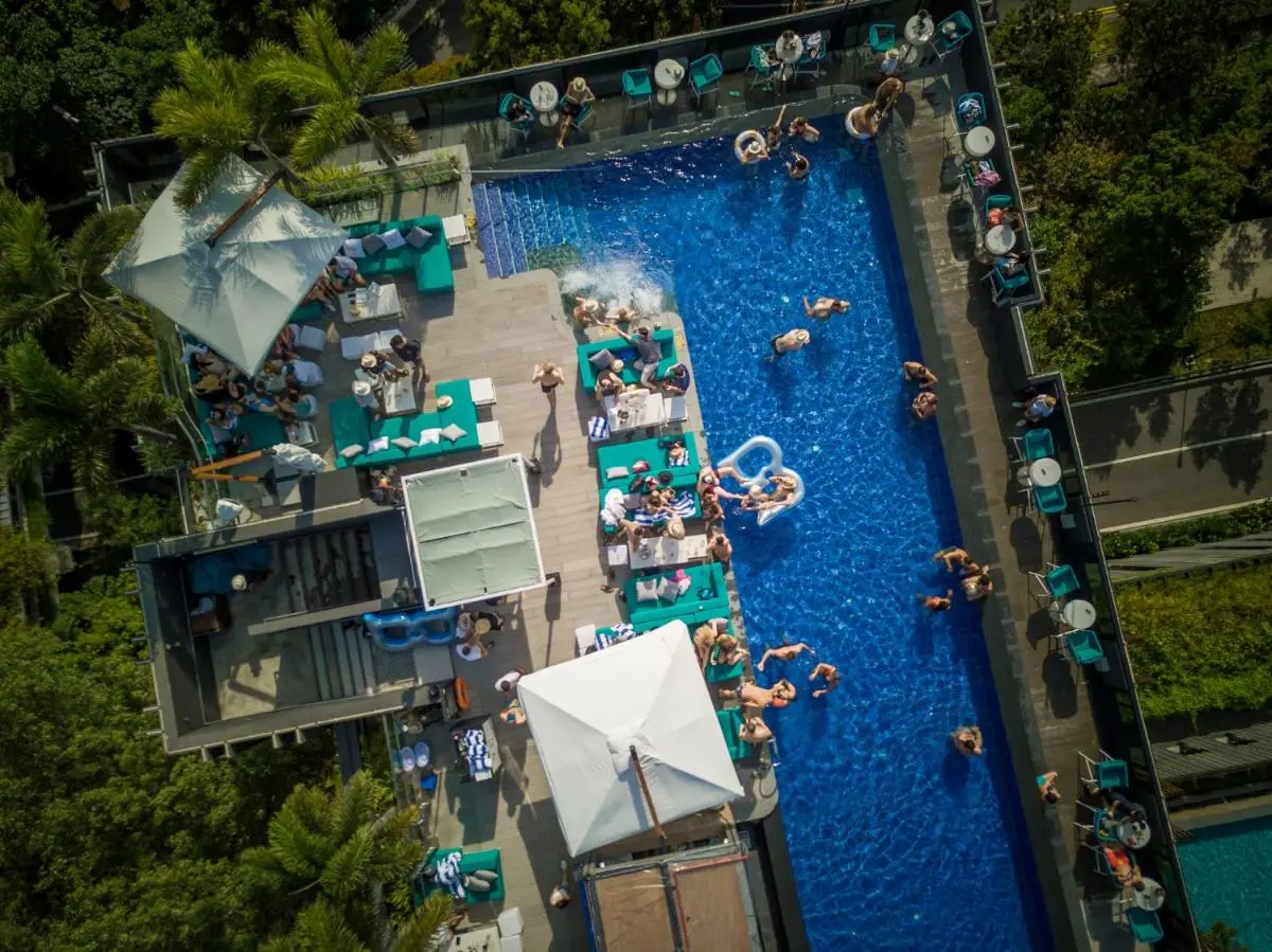 Rooftop Swimming Pool with Lounge Chairs and Urban Views on Sentosa Island