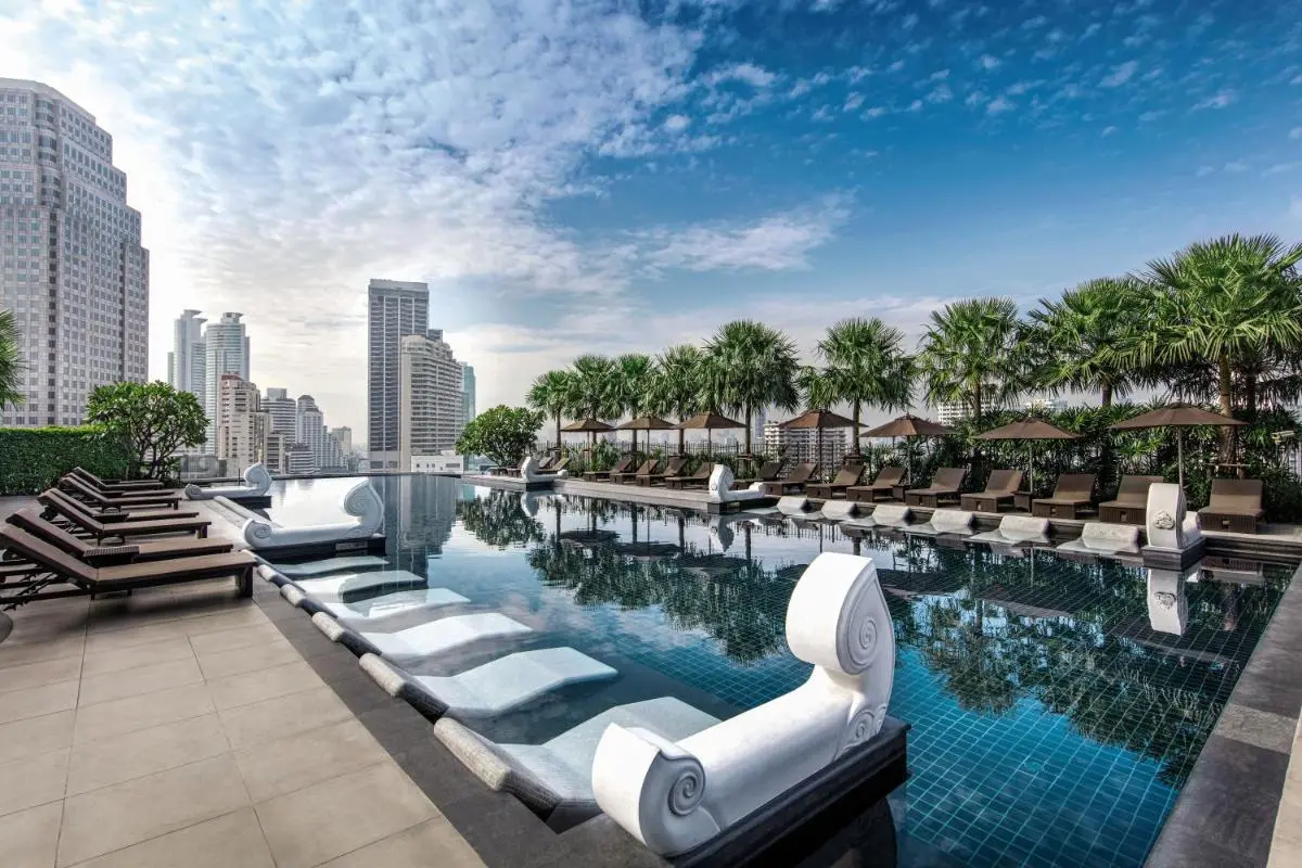 Grande Centre Point Hotel Terminal21 Rooftop Swimming Pool with Lounge Seating and Urban Views in Wattana Bangkok