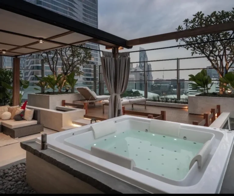Rooftop Wellness Area with Jacuzzi and Lounge Chairs in Pathumwan Bangkok