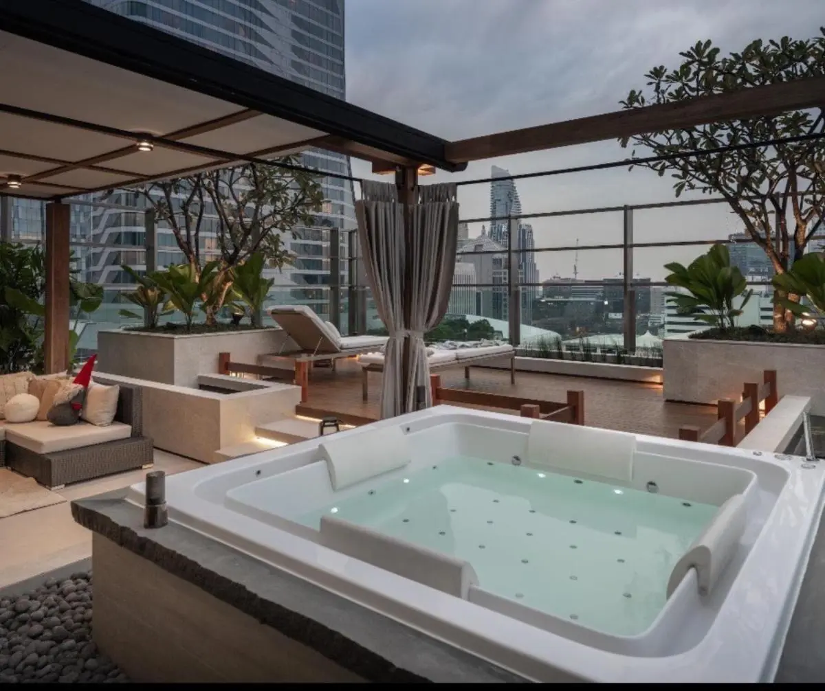 Sivatel Bangkok Hotel Rooftop Wellness Area with Jacuzzi and Lounge Chairs in Pathumwan Bangkok