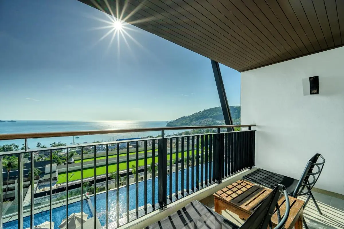 Scenic Balcony View Overlooking Outdoor Pool and Coastal Waters at Patong Beach