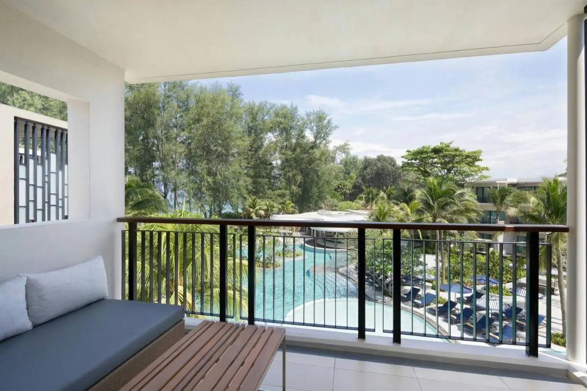 Scenic Pool Area with Lounge Seating and Tropical Landscaping at Mai Khao Beach