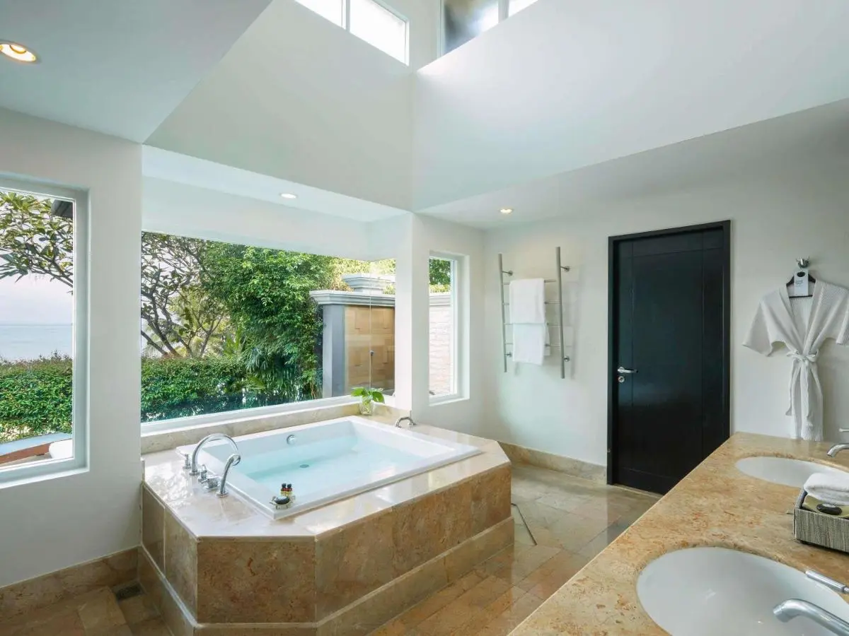 Serene Bathroom with Built-In Bathtub and Scenic Panwa Beach Views