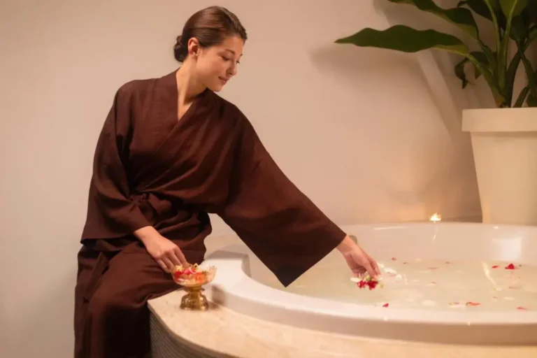 Serene Indoor Jacuzzi with Flower Petals and Soft Lighting in Pathumwan