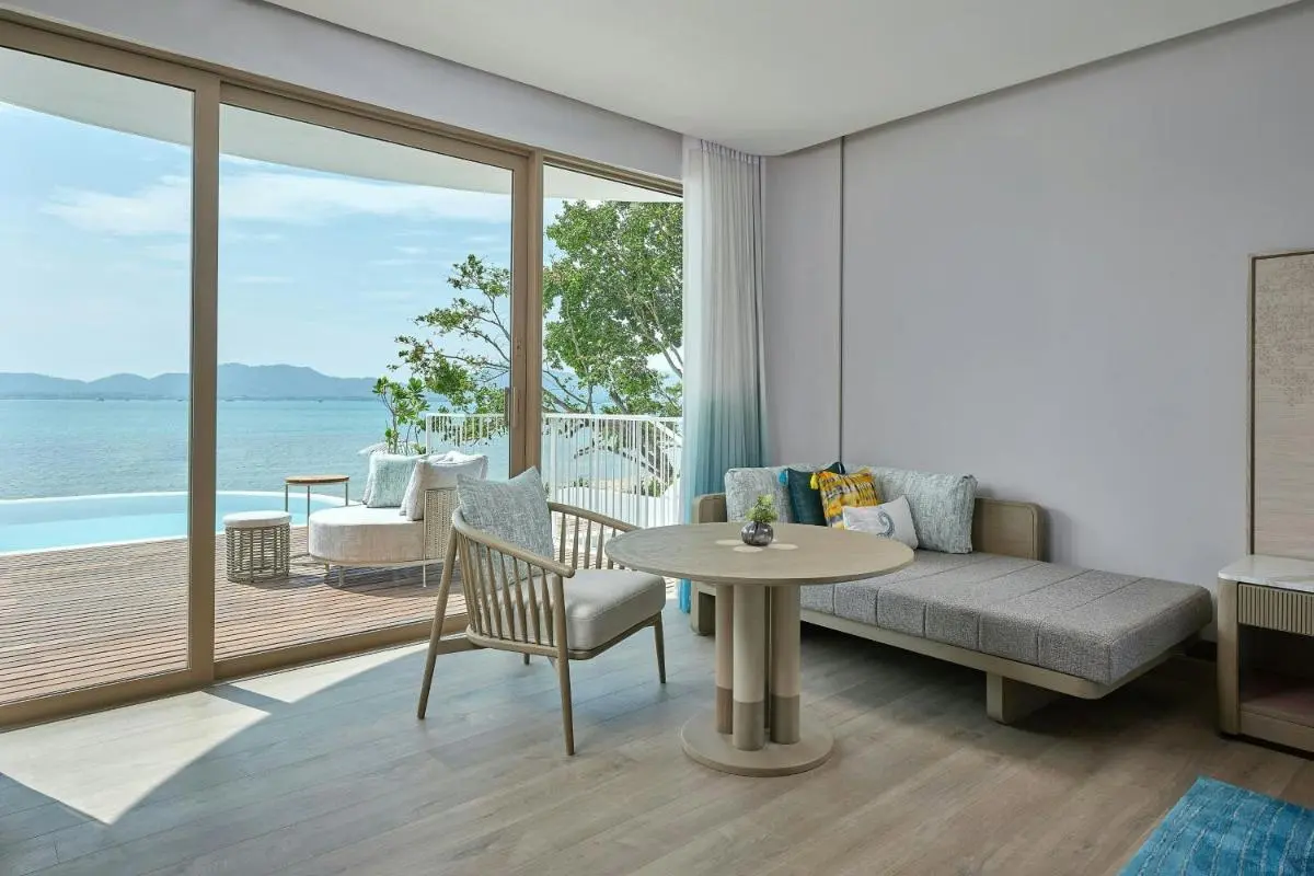 Serene Indoor Living Space with Infinity Pool and Panoramic Water Views at Panwa Beach