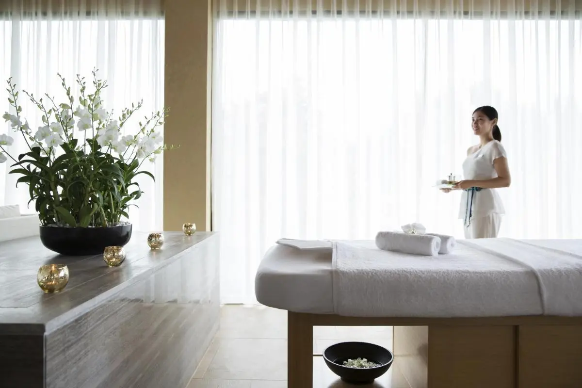 Serene Indoor Spa Room with Massage Table and Relaxation Elements Near Nai Thon Beach