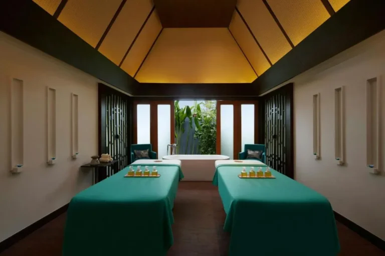 Serene Indoor Spa Room with Massage Tables and Freestanding Bathtub at Mai Khao Beach
