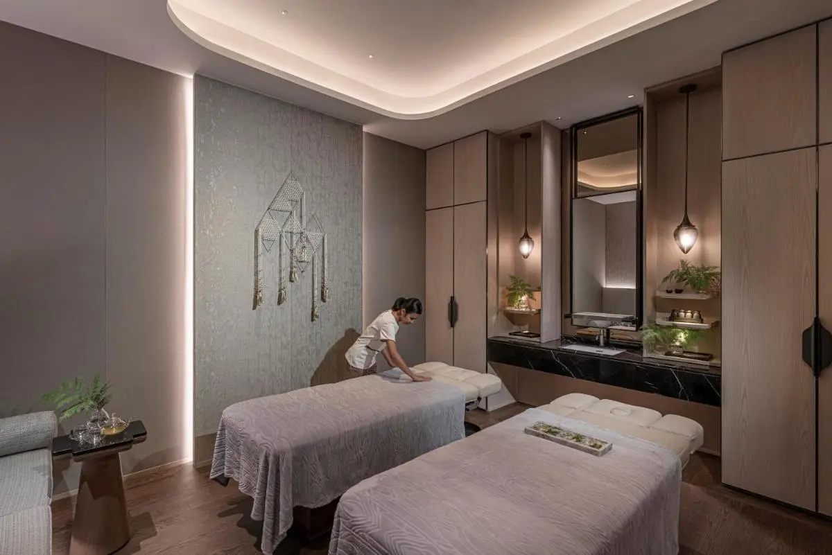 Four Seasons Hotel Bangkok at Chao Phraya River Serene Indoor Spa Treatment Room with Massage Tables and Modern Design in Sathorn Bangkok