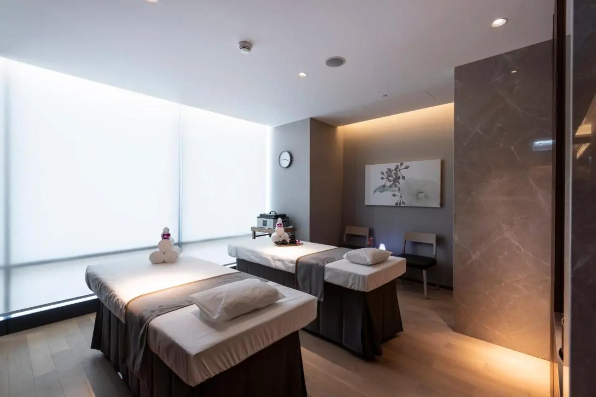 Serene Indoor Wellness Room with Massage Tables and Ambient Lighting in Wattana