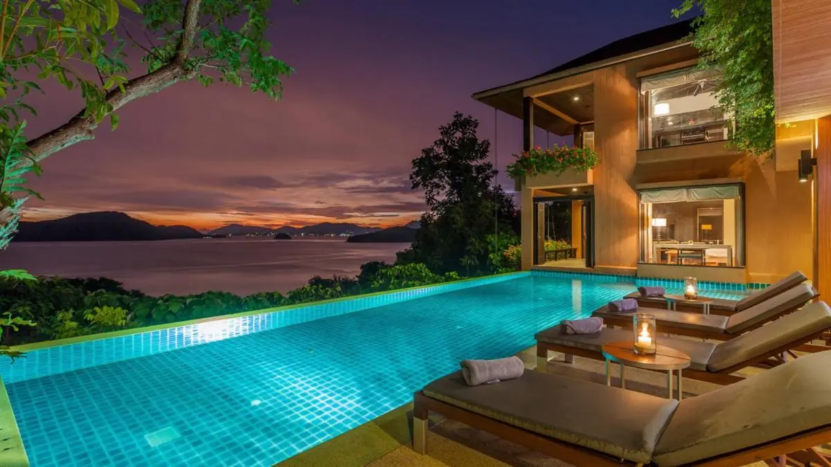 Sri Panwa Phuket Luxury Pool Villa Hotel Serene Infinity Pool and Lounge Area Overlooking Panwa Beach at Sunset