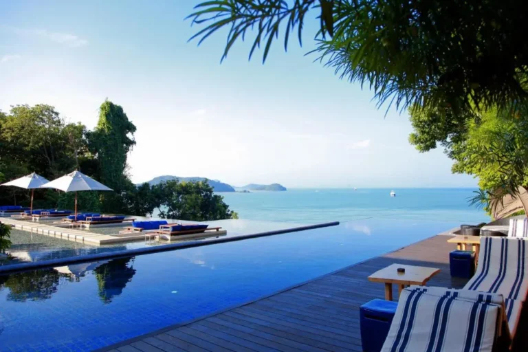 Serene Infinity Pool and Relaxation Area Overlooking Panwa Beach Ocean View
