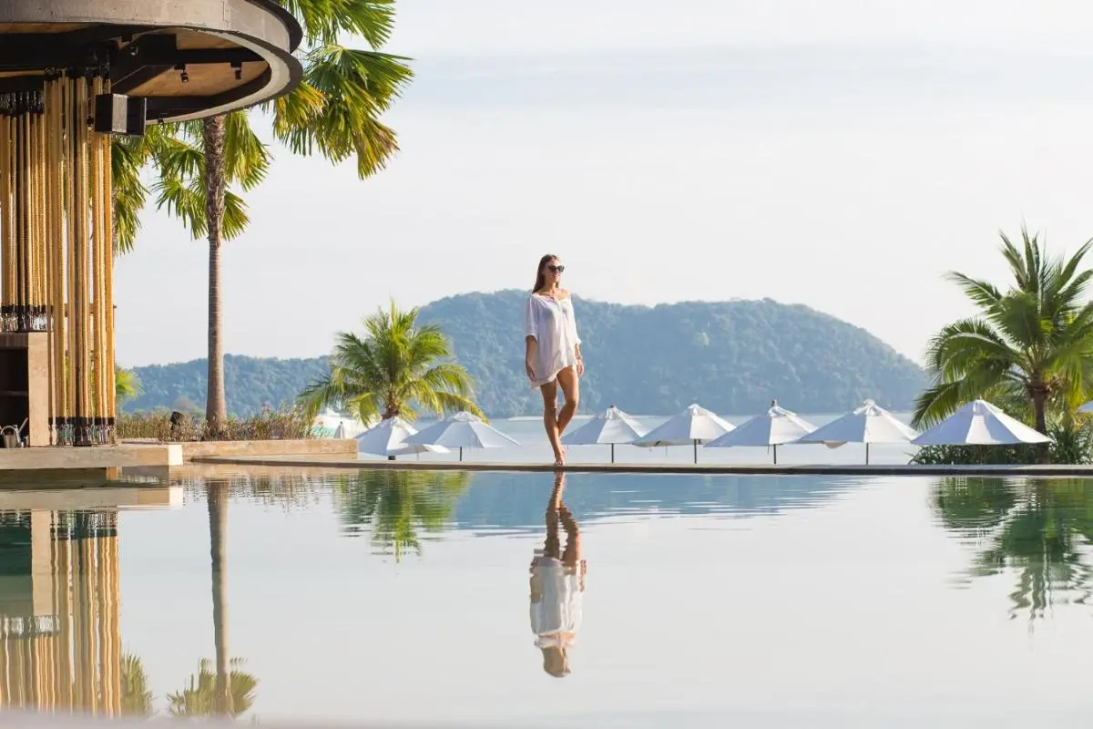 Pullman Phuket Panwa Beach Resort Serene Infinity Pool and Relaxation Area with Palm Trees at Panwa Beach Thailand