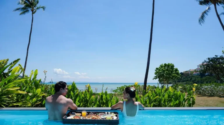 Serene Infinity Pool Overlooking Ocean with Floating Tray at Panwa Beach