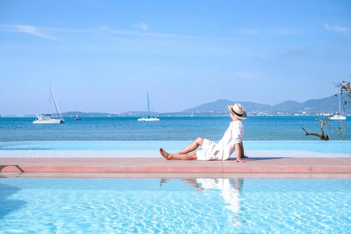 Serene Infinity Pool Overlooking Panwa Beach with Ocean and Sailboats View