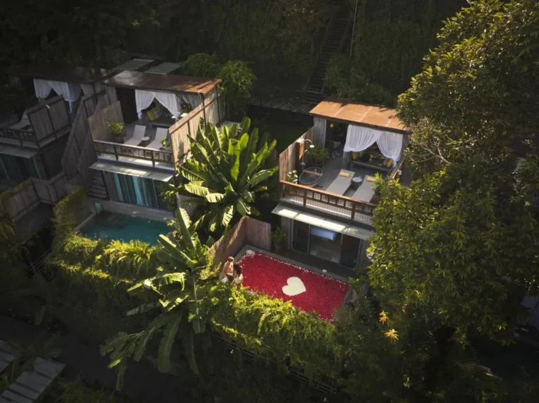 Serene Multi-Level Outdoor Pools and Lounging Areas Surrounded by Lush Tropical Greenery at Patong Beach