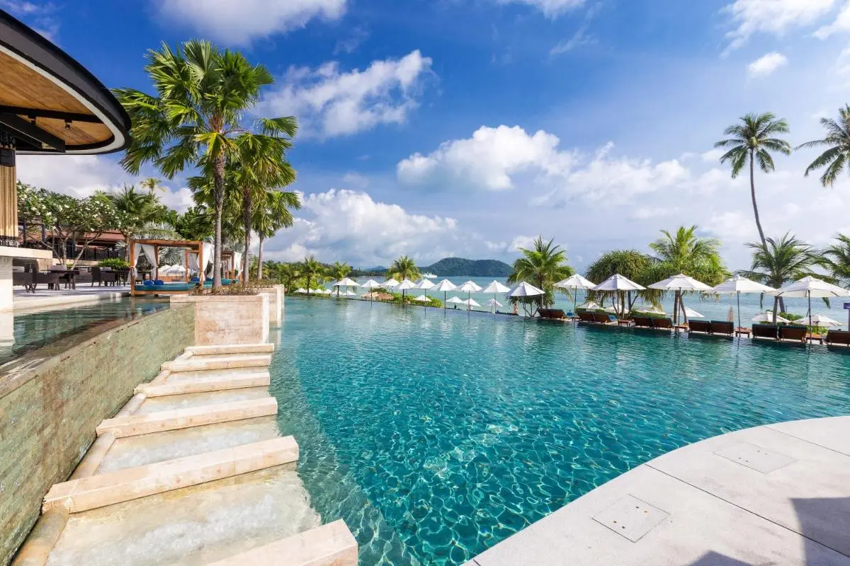 Phuket Province Serene Outdoor Infinity Pool and Relaxation Area Overlooking Panwa Beach Coastline