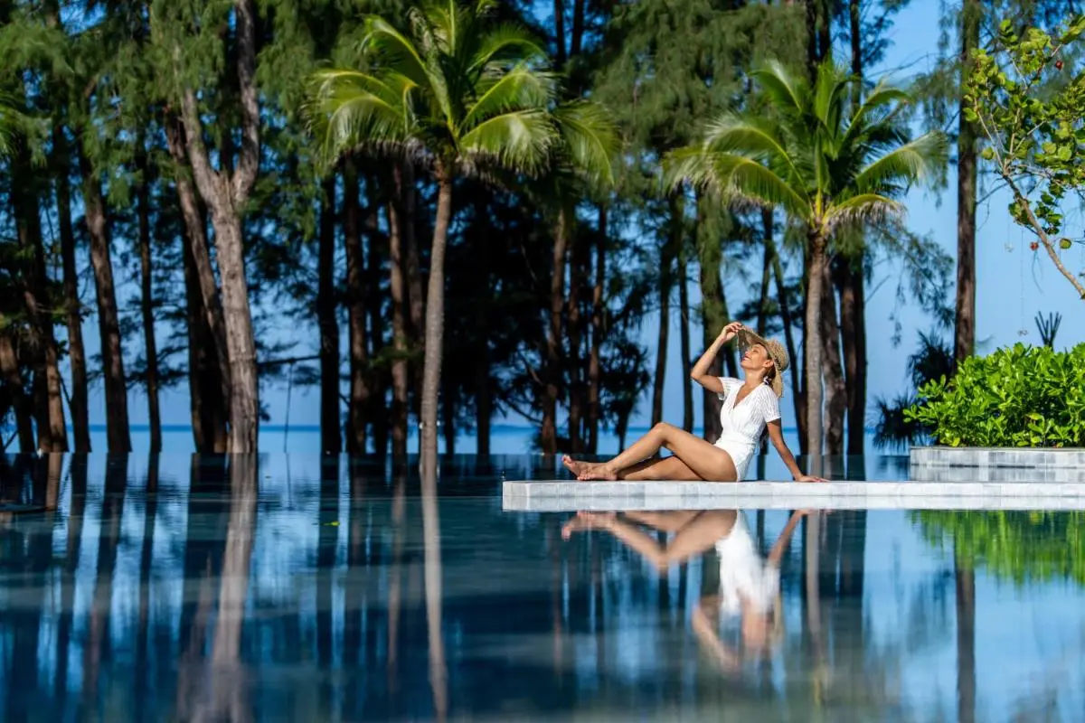 Serene Outdoor Infinity Pool with Ocean Views and Tropical Surroundings at Mai Khao Beach