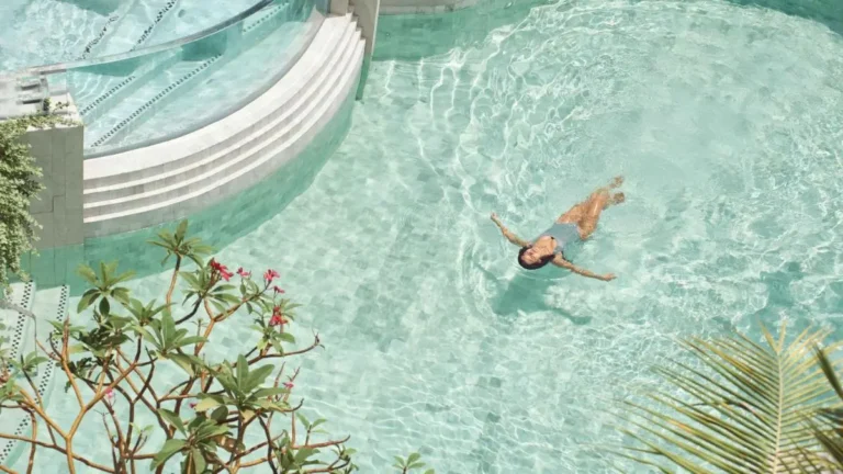 Serene Outdoor Swimming Pool and Jacuzzi Area with Tropical Plants in Pathumwan