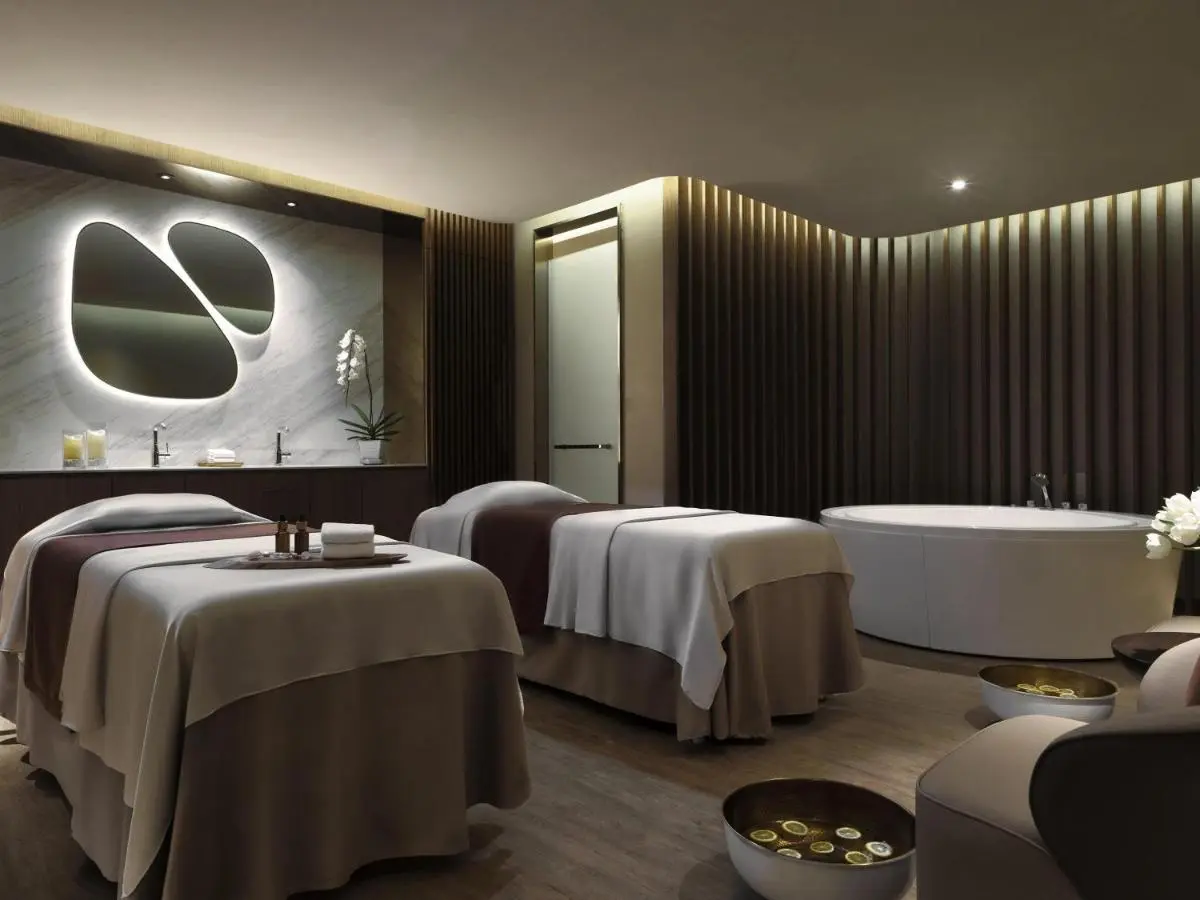 Mövenpick BDMS Wellness Resort Bangkok Serene Spa Room with Massage Tables and Freestanding Bathtub in Pathumwan Bangkok