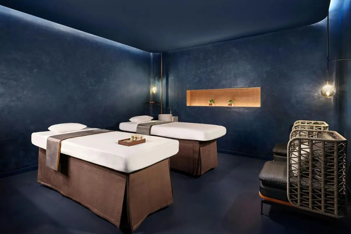 Serene Spa Treatment Room with Dual Massage Tables and Ambient Lighting at Panwa Beach