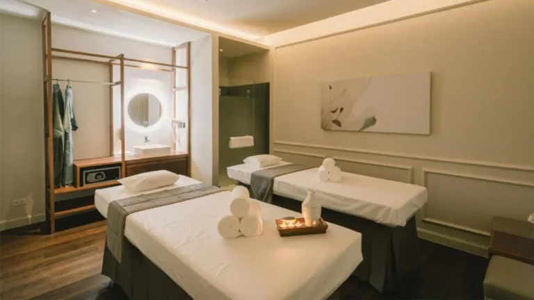 Serene Spa Treatment Room with Massage Tables and Glass Shower in Bang Rak