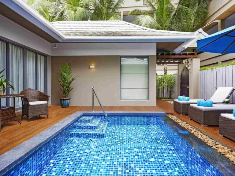Small Outdoor Pool with Blue Mosaic Tiles and Relaxing Lounge Area at Patong Beach