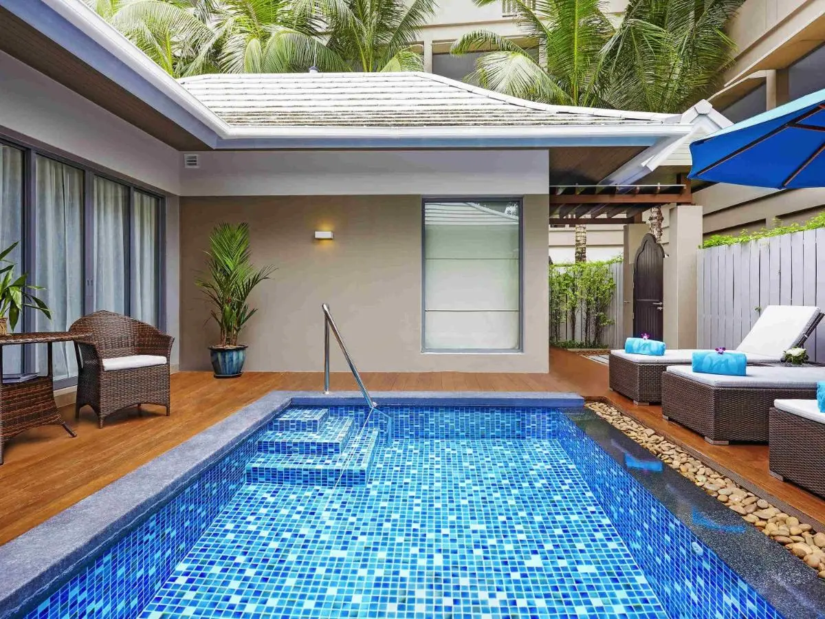 Grand Mercure Phuket Patong Small Outdoor Pool with Blue Mosaic Tiles and Relaxing Lounge Area at Patong Beach Thailand
