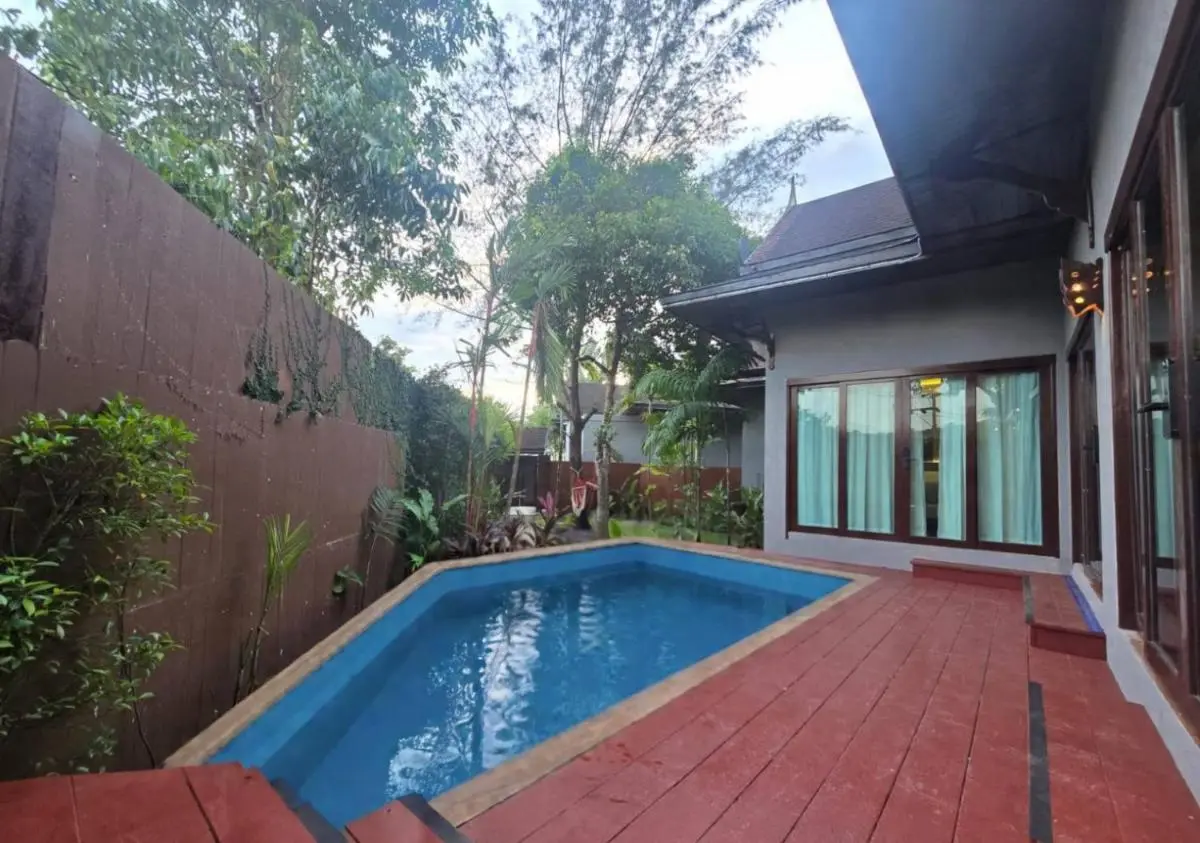 Small Outdoor Rectangular Swimming Pool with Blue Lining and Red-Tiled Deck in Thalang