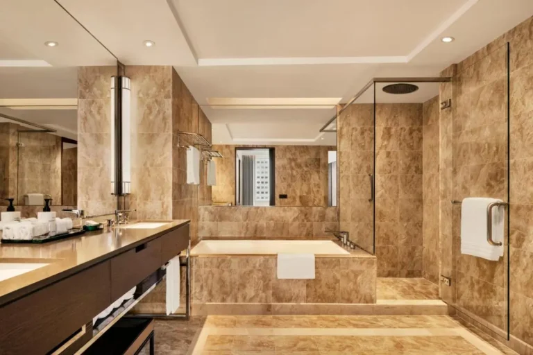 Spacious Bathroom with Bathtub and Walk-In Shower in Marina Bay