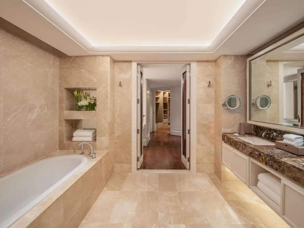 Spacious Bathroom with Built-In Bathtub and Marble Vanity in Wattana Bangkok