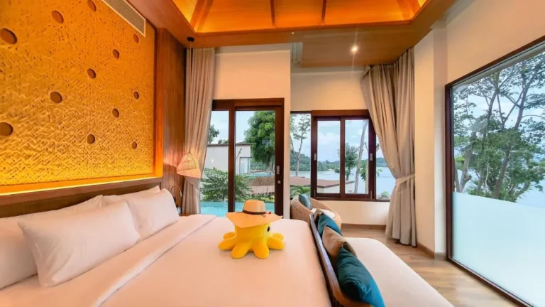 Spacious Bedroom with Pool View and Natural Light in Phuket Town Setting
