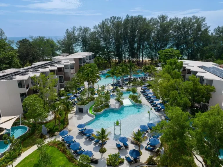Spacious Interconnected Swimming Pools with Lounge Areas and Coastal Views at Mai Khao Beach