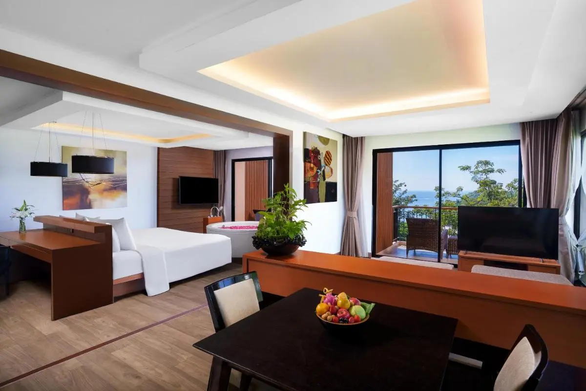 Spacious Modern Suite with Jacuzzi, Balcony Views, and Elegant Living Areas at Kata Beach