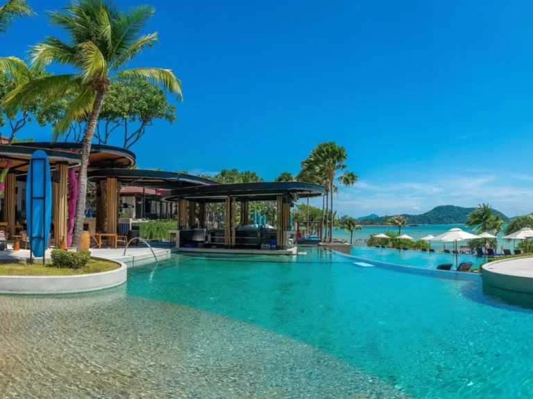 Spacious Outdoor Swimming Pool with Swim-Up Bar and Tropical Surroundings at Panwa Beach