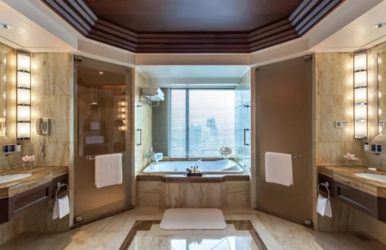 Spacious Symmetrical Bathroom with Marble Bathtub and Showers in Khlong San Bangkok