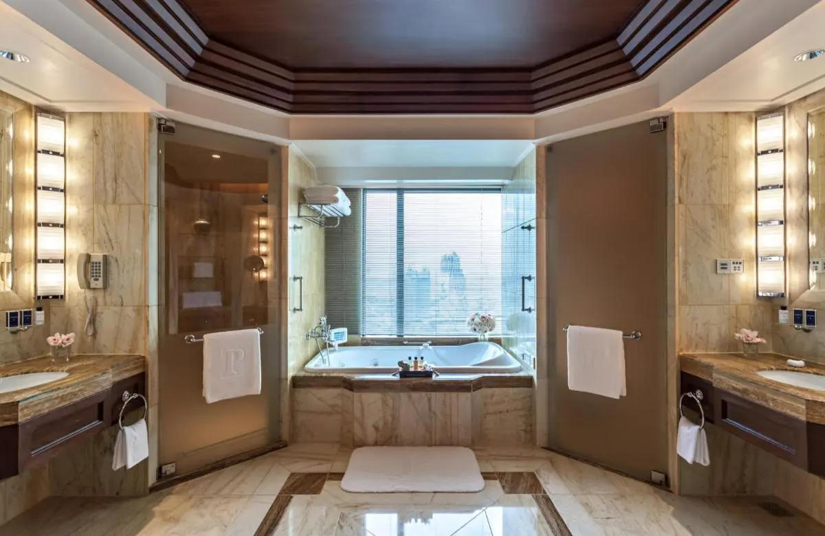 Spacious Symmetrical Bathroom with Marble Bathtub and Showers in Khlong San Bangkok