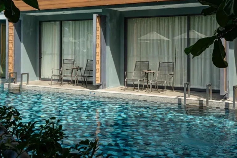 Swimming Pool Area with Adjacent Private Rooms and Outdoor Seating at Patong Beach