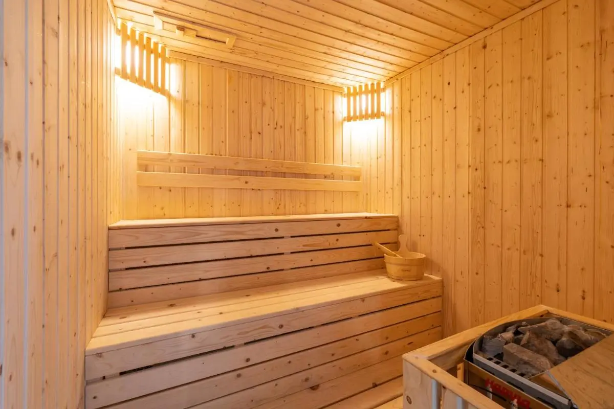 Kantary Hills Hotel, Chiang Mai Traditional Wooden Sauna Interior with Two-Tiered Benches and Heater in Chiang Mai
