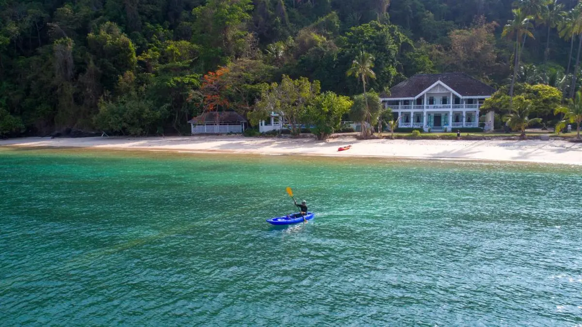 Phuket Province Tranquil Coastal Scene at Panwa Beach with Kayaking and Natural Shoreline
