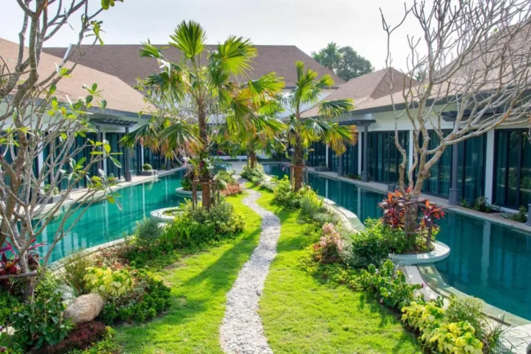 Tranquil Courtyard with Parallel Swimming Pools and Lush Garden in Chalong