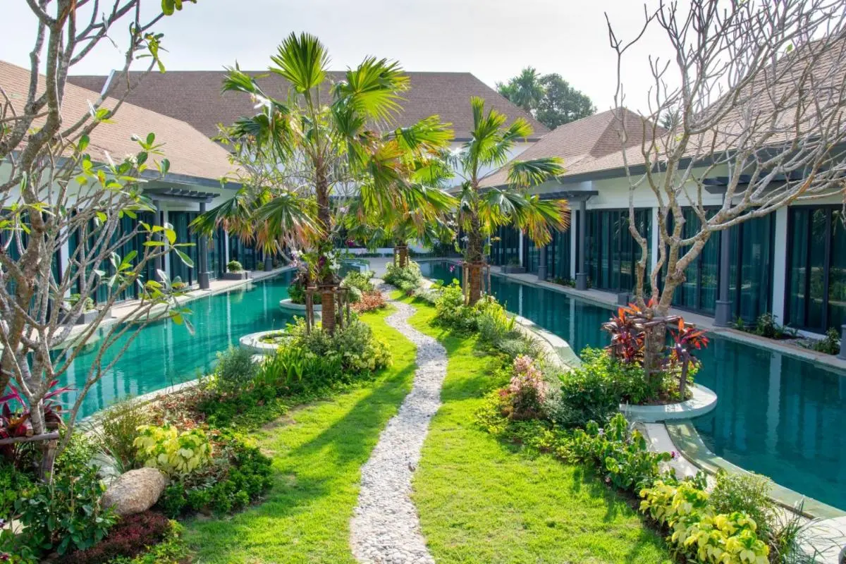 Tranquil Courtyard with Parallel Swimming Pools and Lush Garden in Chalong